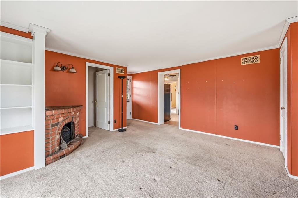 1027 Myrtle Place Sharon, PA 16146 - Photo 12 of 19 a view of an empty room with furniture and a fireplace