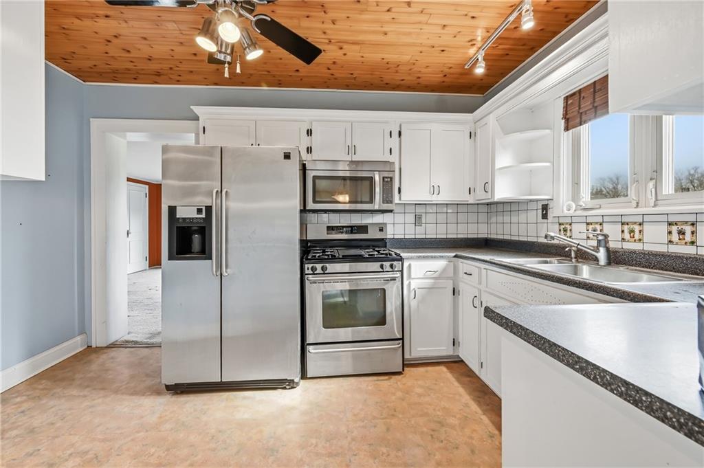 1027 Myrtle Place Sharon, PA 16146 - Photo 13 of 19 a kitchen with stainless steel appliances a stove sink and microwave