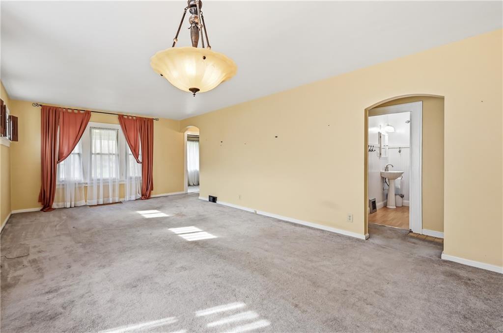 1027 Myrtle Place Sharon, PA 16146 - Photo 4 of 19 a view of empty room with wooden floor and fan