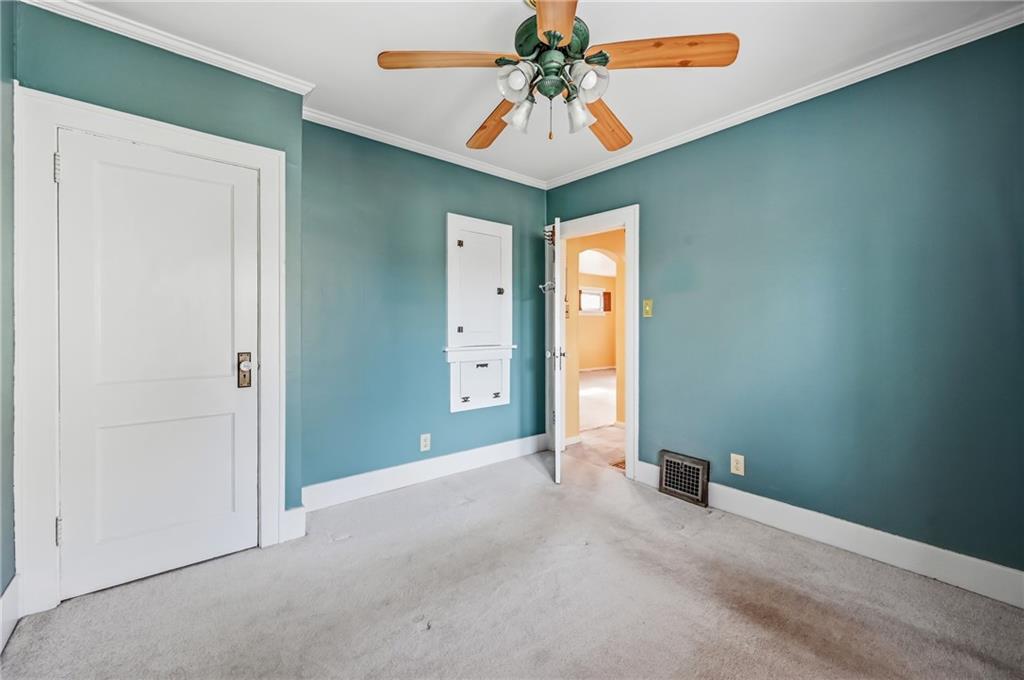 1027 Myrtle Place Sharon, PA 16146 - Photo 6 of 19 an empty room with closet and a chandelier fan