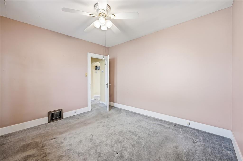 1027 Myrtle Place Sharon, PA 16146 - Photo 9 of 19 an empty room with chandelier fan