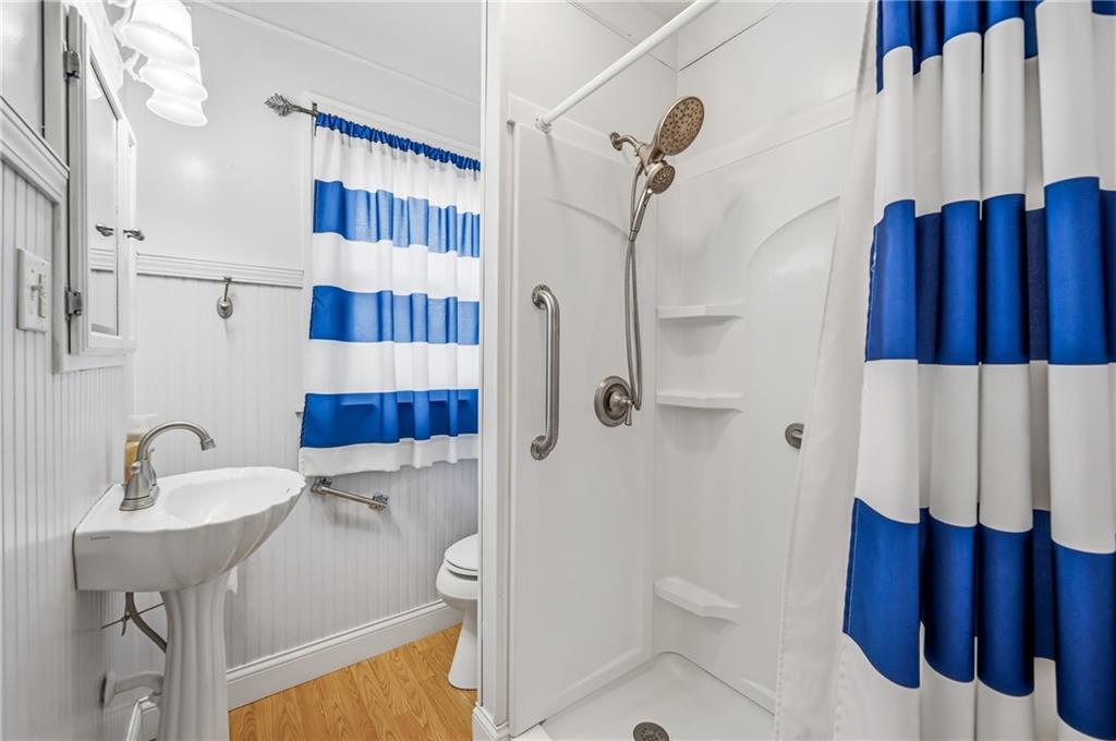 1027 Myrtle Place Sharon, PA 16146 - Photo 10 of 19 a bathroom with a sink a toilet and shower