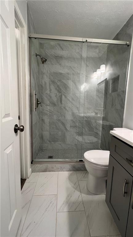 4007 Burns Road Northwest Lilburn, GA 30047 - Photo 18 of 20 a bathroom with a toilet and a shower