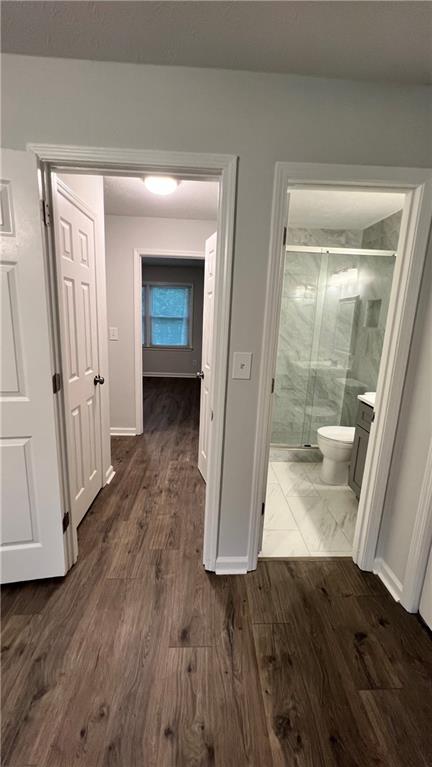 4007 Burns Road Northwest Lilburn, GA 30047 - Photo 20 of 20 a view of a hallway with wooden floor and entryway