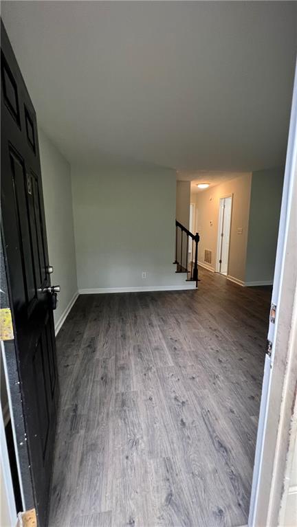 4007 Burns Road Northwest Lilburn, GA 30047 - Photo 4 of 20 a view of a room with wooden floor and staircase