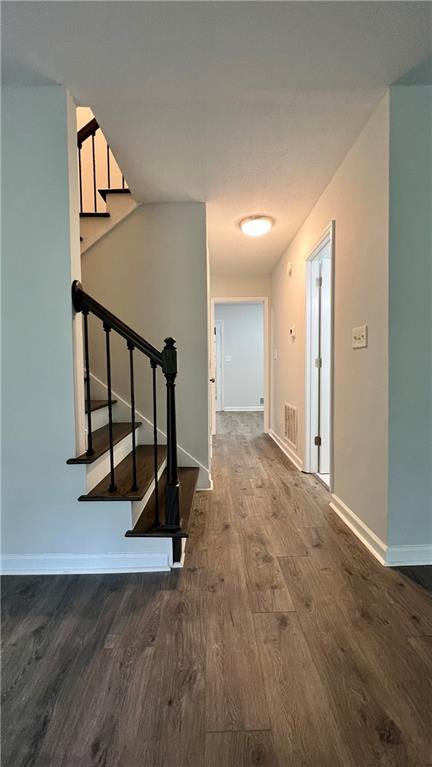 4007 Burns Road Northwest Lilburn, GA 30047 - Photo 7 of 20 a view of a hallway with staircase