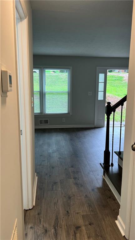 4007 Burns Road Northwest Lilburn, GA 30047 - Photo 8 of 20 a view of a room with window wooden floor and windows