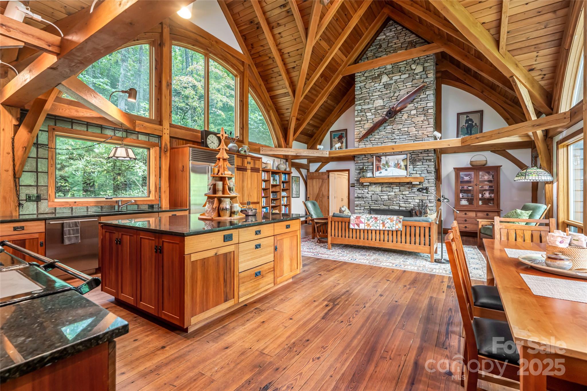 147 Dye Leaf Road Fairview, NC 28730 - Photo 11 of 46 a view of a porch with wooden floor and roof