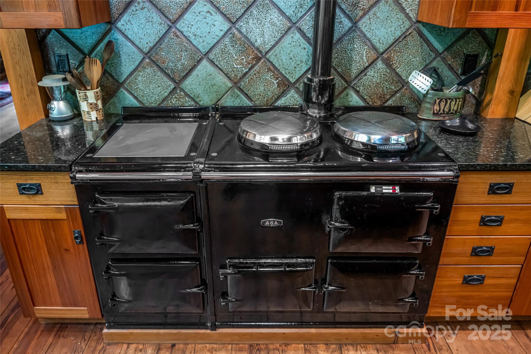 147 Dye Leaf Road Fairview, NC 28730 - Photo 12 of 46 a stove top oven sitting inside of a kitchen