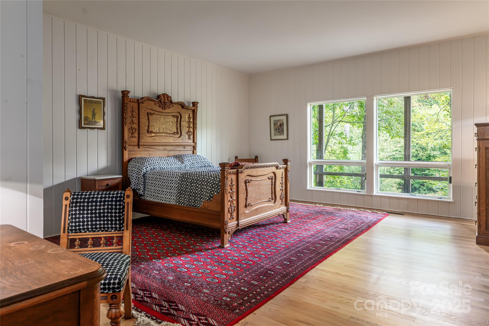 147 Dye Leaf Road Fairview, NC 28730 - Photo 14 of 46 a bedroom with furniture and a window
