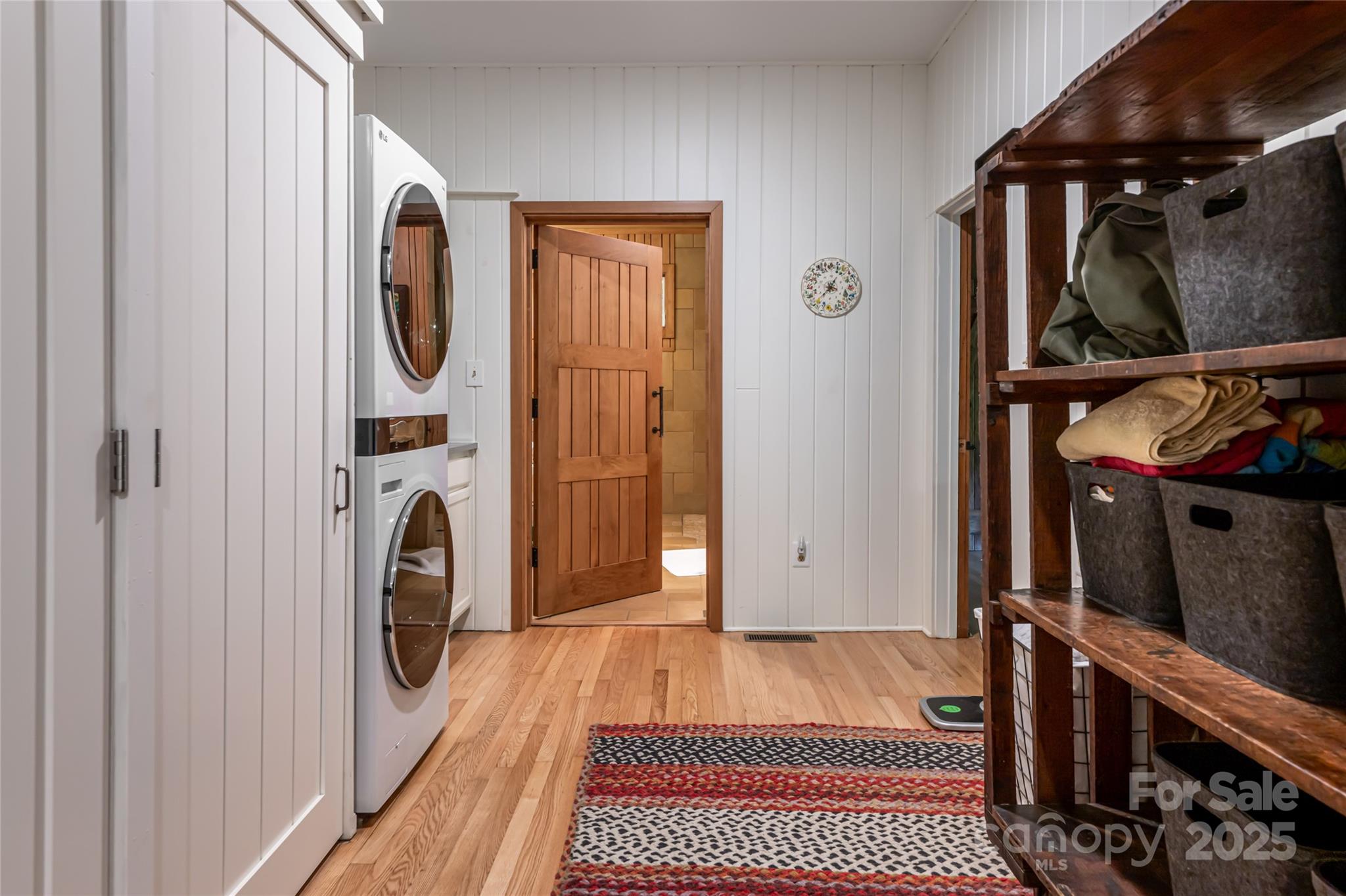 147 Dye Leaf Road Fairview, NC 28730 - Photo 17 of 46 a view of a hallway with washer and dryer