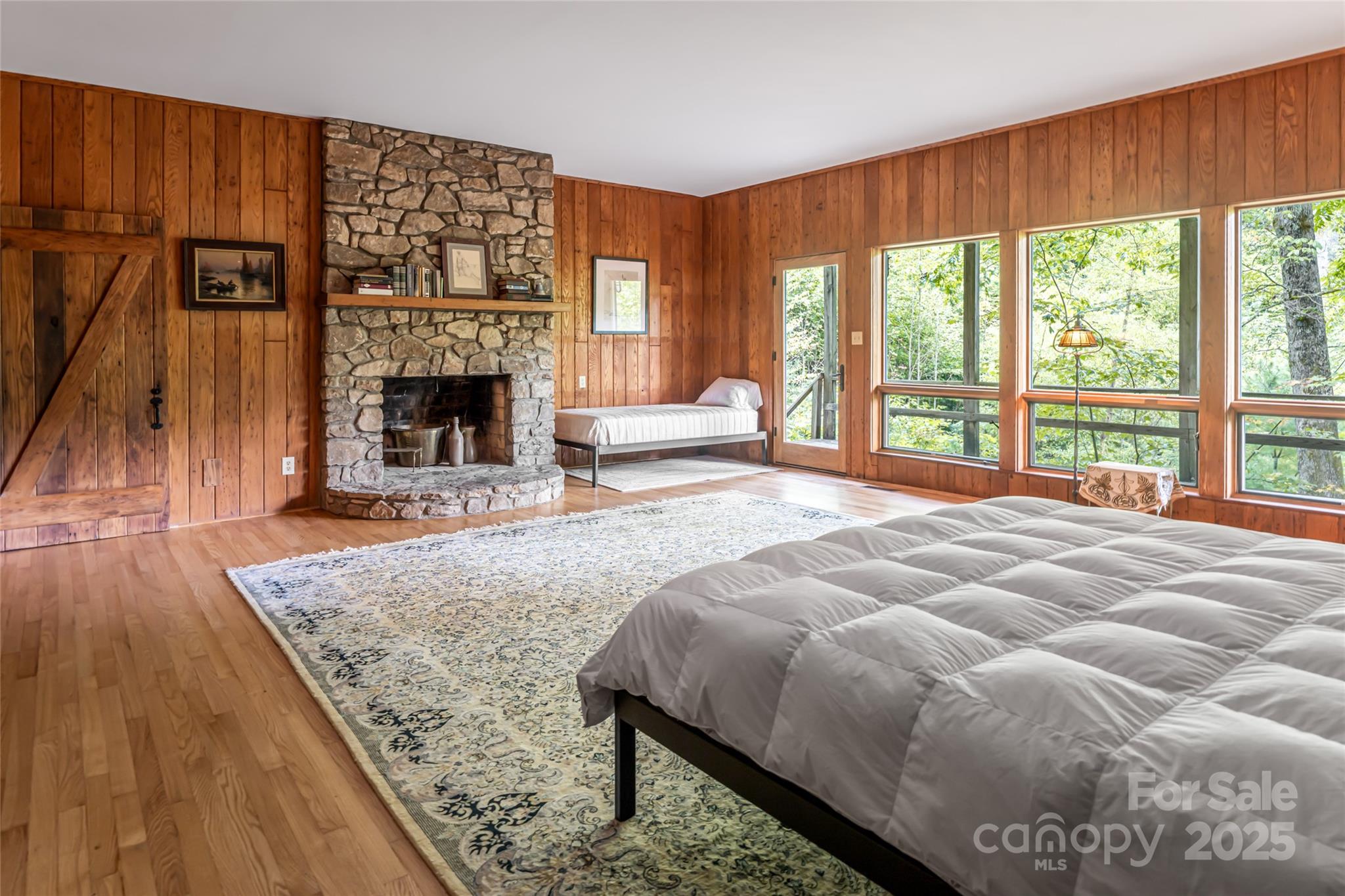 147 Dye Leaf Road Fairview, NC 28730 - Photo 19 of 46 a bed sitting in a spacious bedroom next to a window