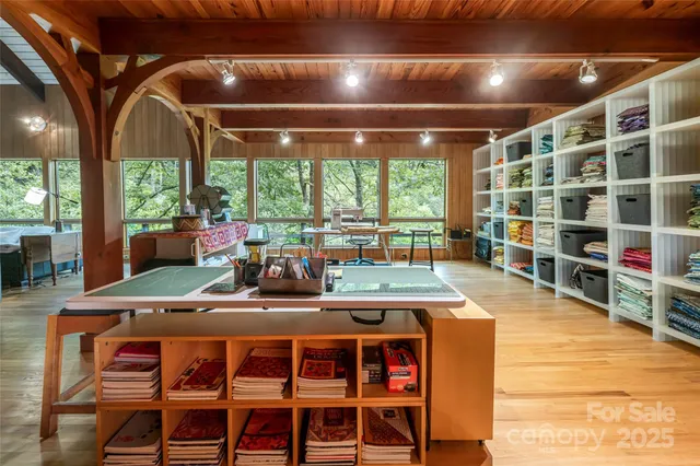 a bedroom with a bed and wooden floors