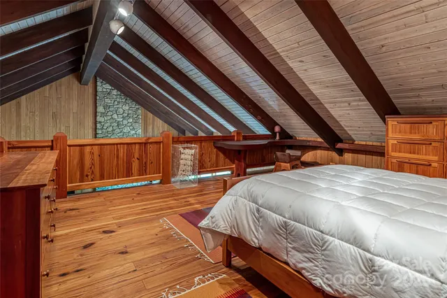 a backyard of a house with a yard and outdoor seating