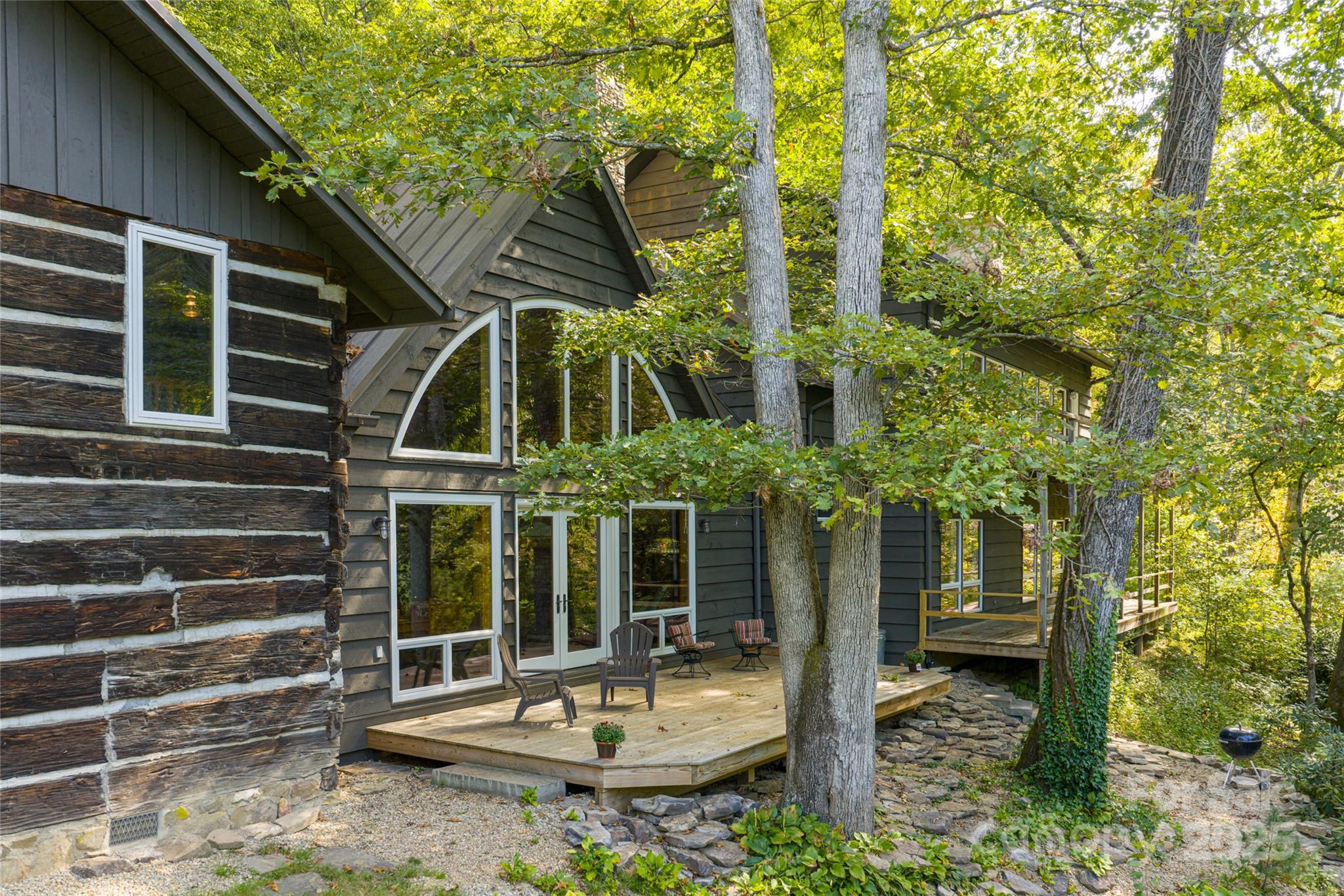 147 Dye Leaf Road Fairview, NC 28730 - Photo 31 of 46 a front view of a house with a garden
