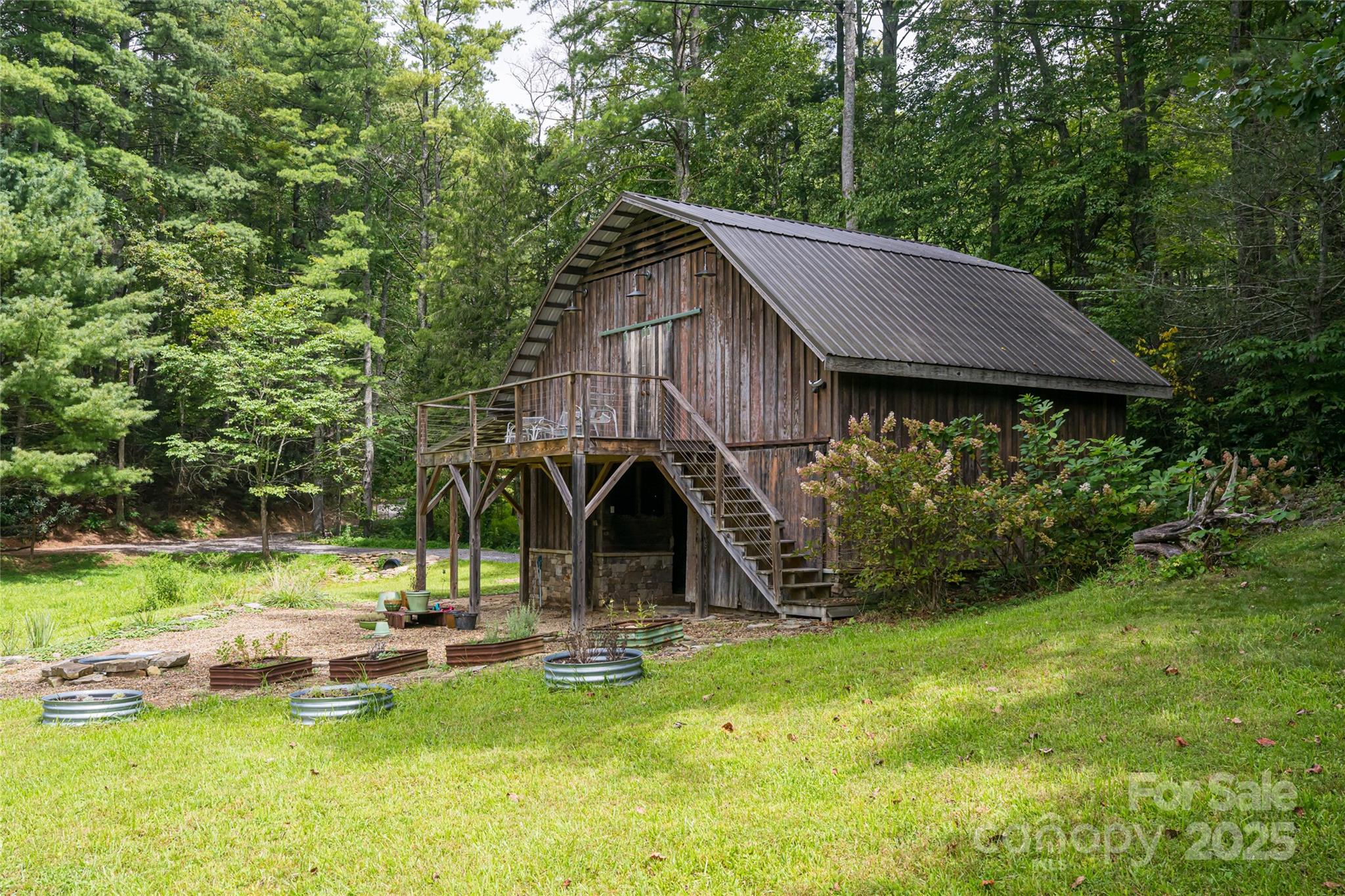 147 Dye Leaf Road Fairview, NC 28730 - Photo 33 of 46 a view of a backyard with a table and chairs