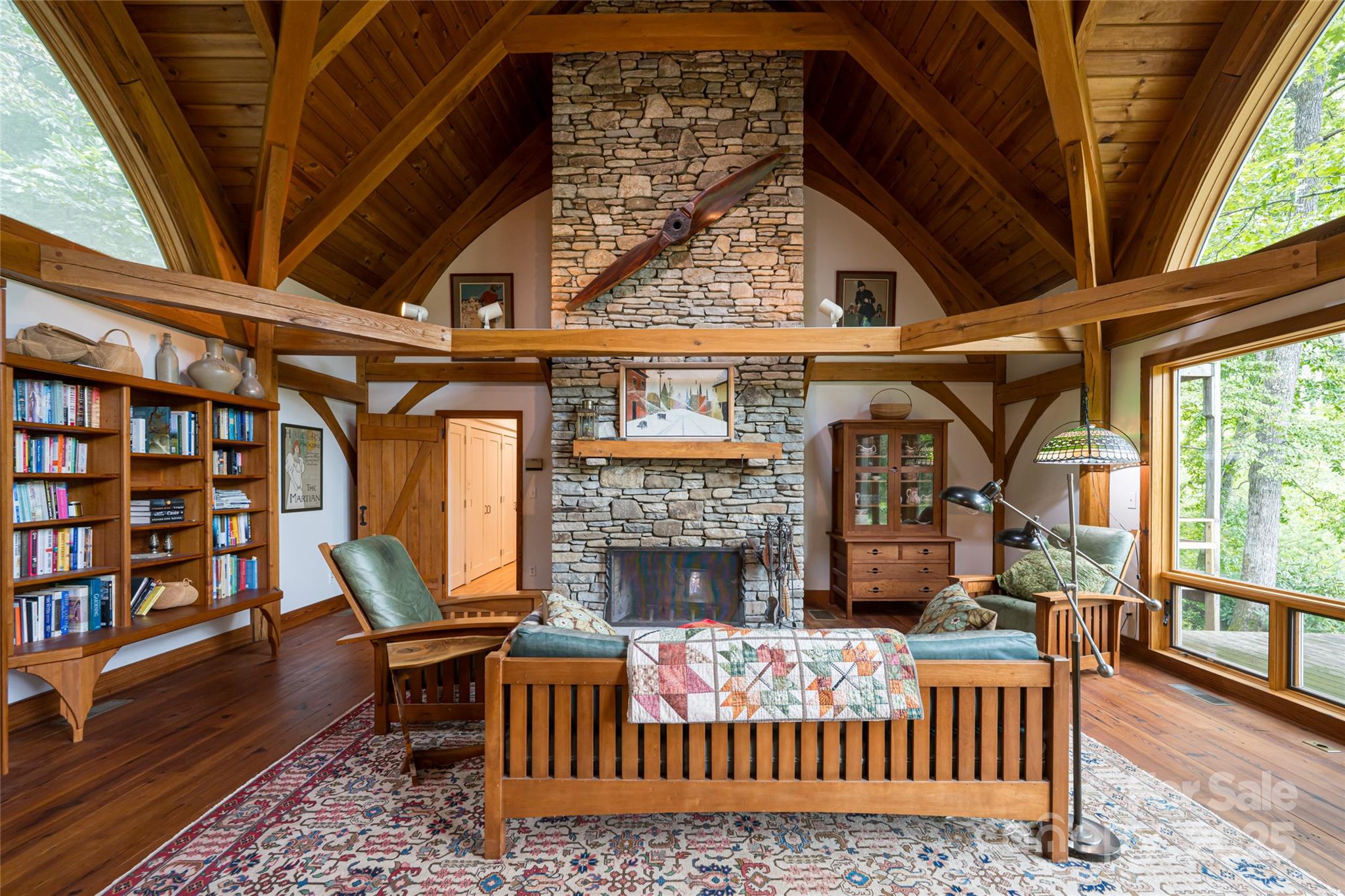 147 Dye Leaf Road Fairview, NC 28730 - Photo 7 of 46 a living room with furniture a fireplace and a floor to ceiling window