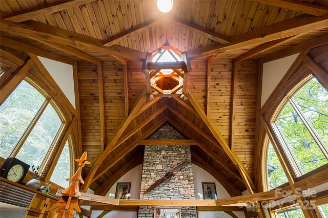 a dining room with wooden floor a glass table and chairs