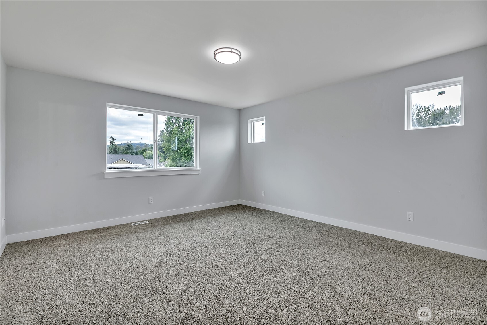 608 B Deeded Street Orting, WA 98360 - Photo 14 of 26 an empty room with windows