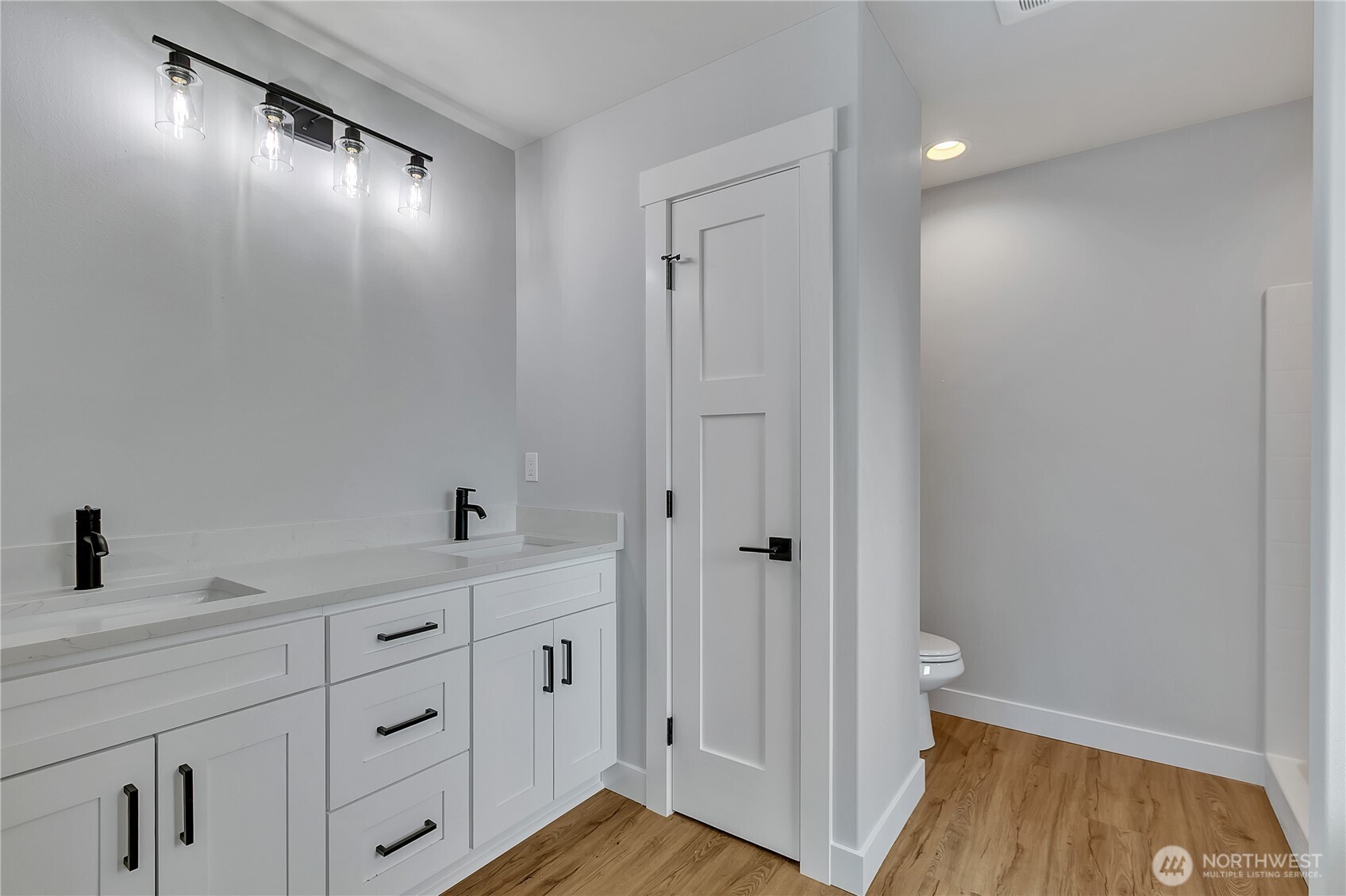 608 B Deeded Street Orting, WA 98360 - Photo 16 of 26 a bathroom with a sink and a mirror