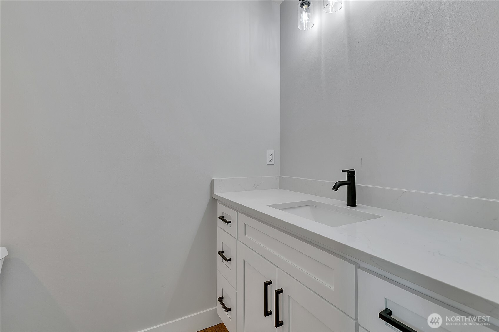 608 B Deeded Street Orting, WA 98360 - Photo 19 of 26 a bathroom with a sink and vanity