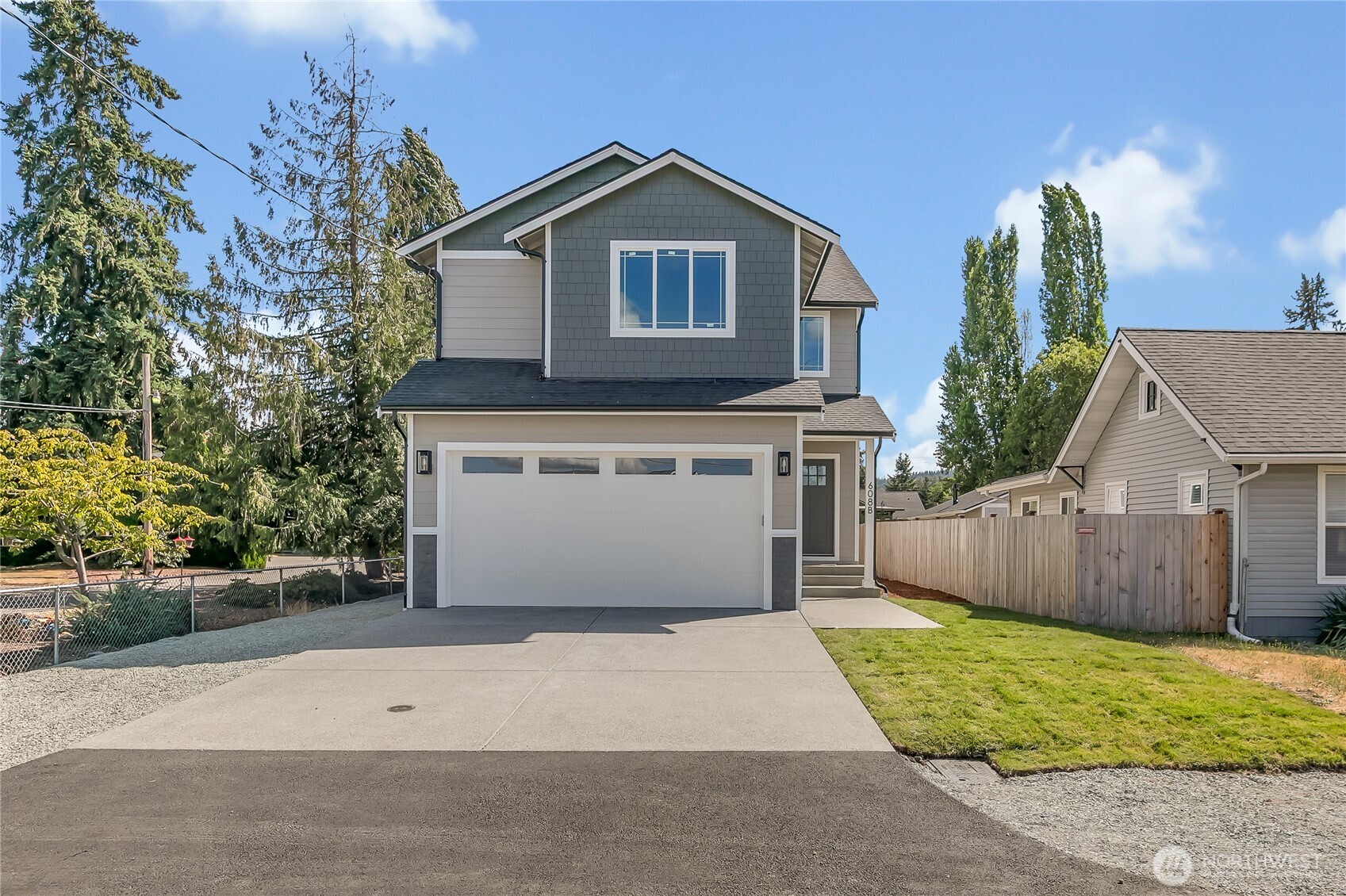 608 B Deeded Street Orting, WA 98360 - Photo 2 of 26 front view of a house with a yard