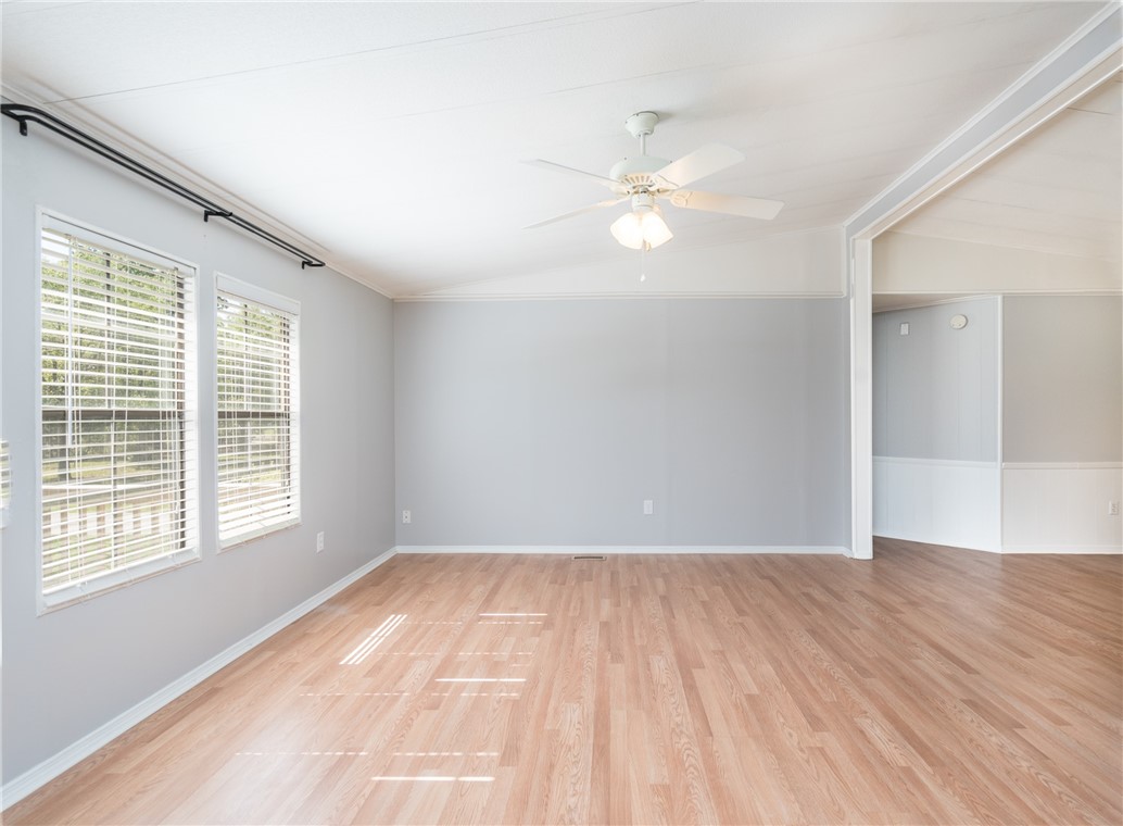 54277 Armstrong Road Callahan, FL 32011 - Photo 8 of 35 a view of empty room with wooden floor and fan