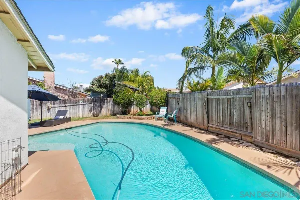 a view of swimming pool with a backyard