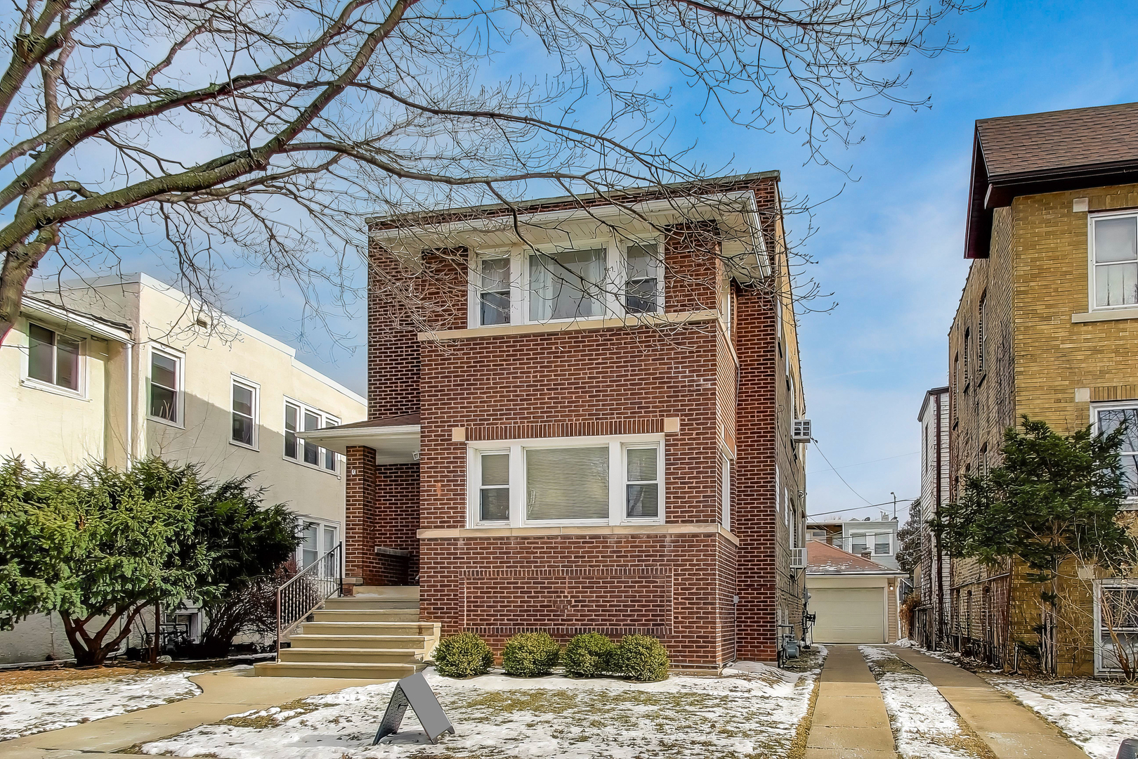 620 Elgin Avenue, Unit 2 Forest Park, IL 60130 - Photo 1 of 25 a brick house with tree in front of it