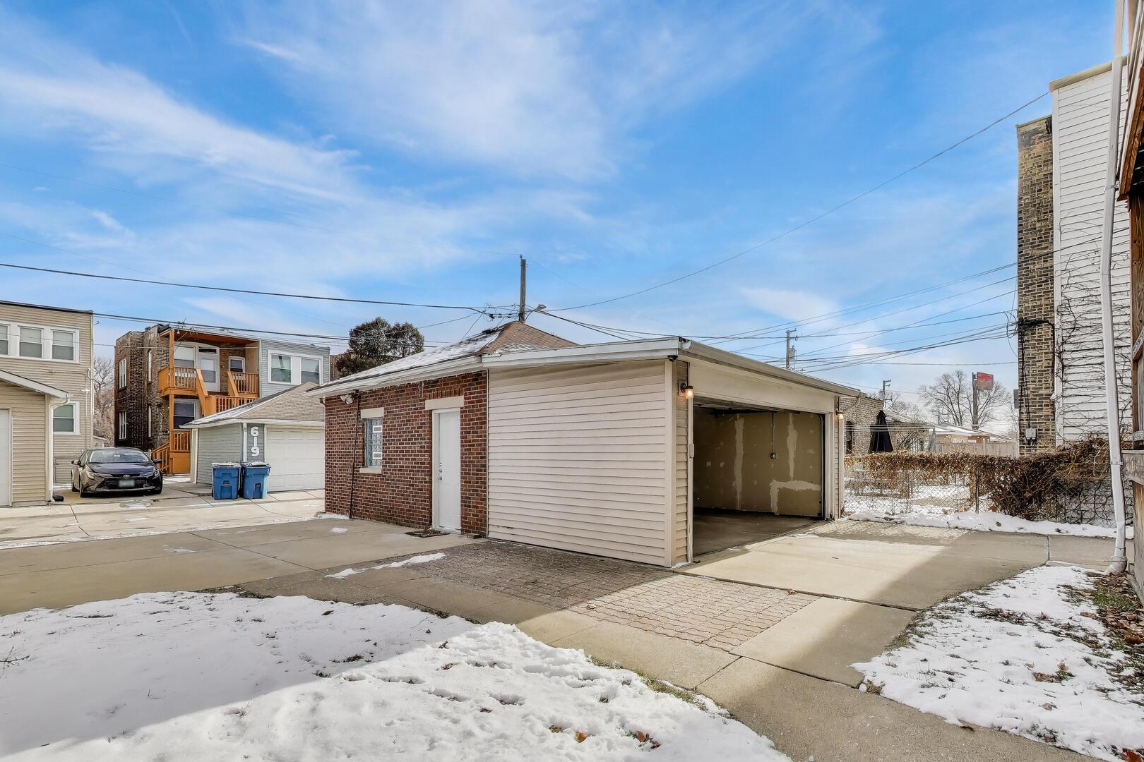 620 Elgin Avenue, Unit 2 Forest Park, IL 60130 - Photo 24 of 25 a view of a white house with a street
