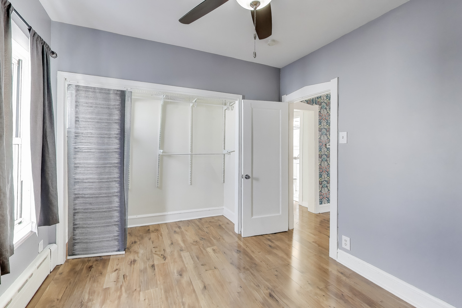 620 Elgin Avenue, Unit 2 Forest Park, IL 60130 - Photo 9 of 25 wooden floor in an empty room with a window