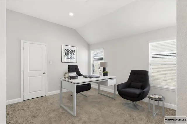 a workspace with furniture and window