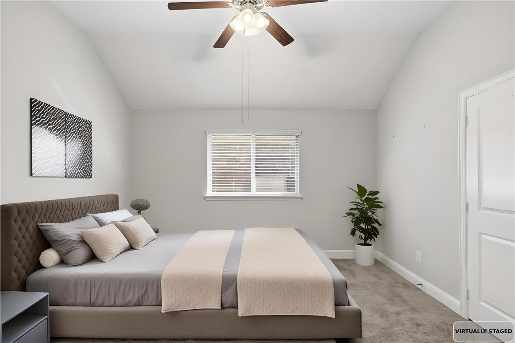 413 Allbright Road Celina, TX 75009 - Photo 22 of 37 a bedroom with a bed and a potted plant