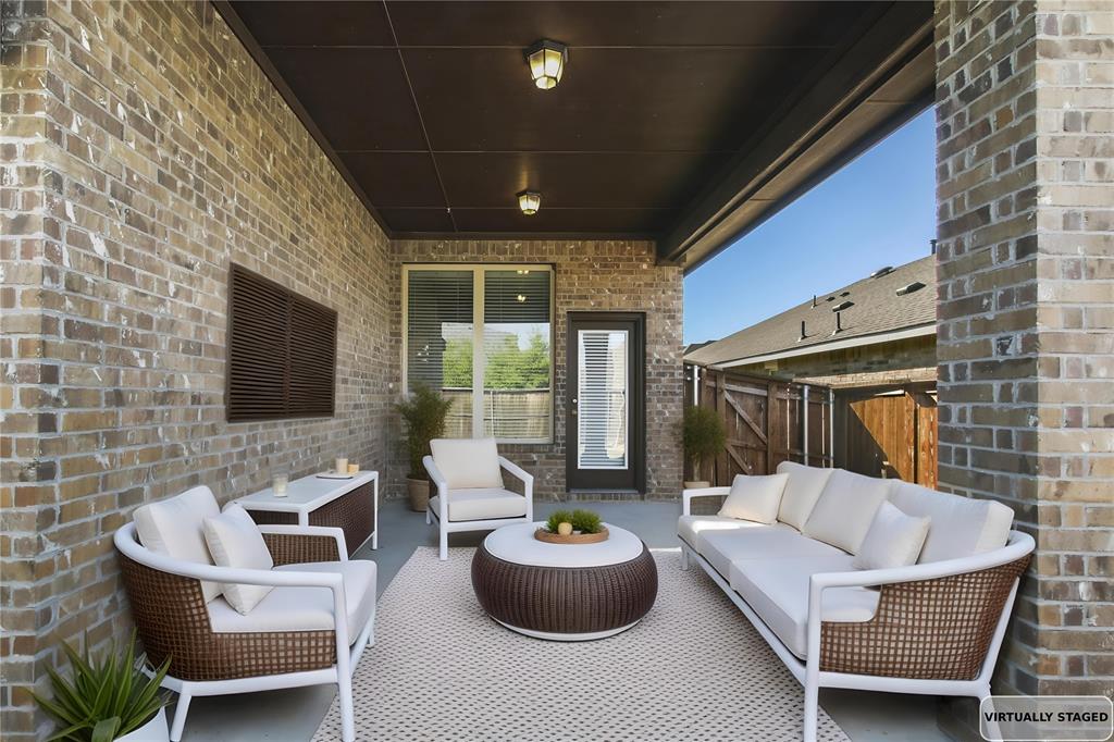 413 Allbright Road Celina, TX 75009 - Photo 27 of 37 a living room with furniture and a flat screen tv