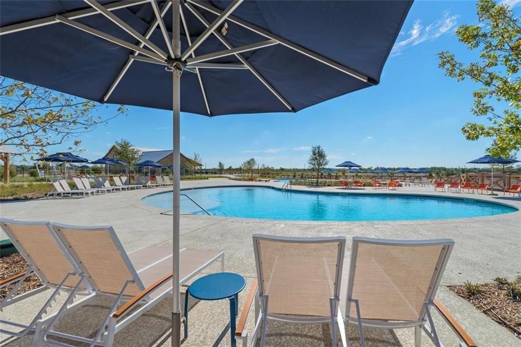 413 Allbright Road Celina, TX 75009 - Photo 35 of 37 a blue and white table and chair under an umbrella