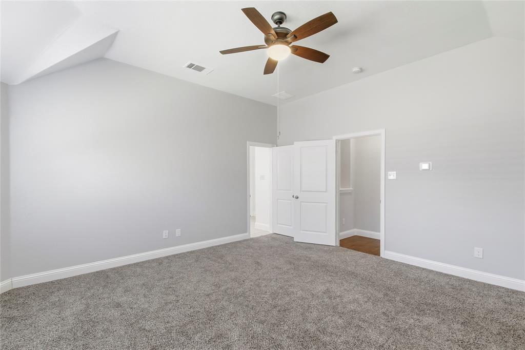 413 Allbright Road Celina, TX 75009 - Photo 6 of 37 an empty room with closet and fan