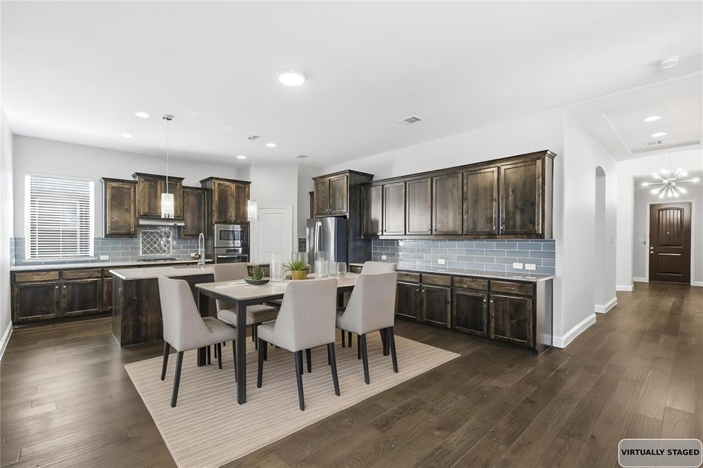 413 Allbright Road Celina, TX 75009 - Photo 10 of 37 a large kitchen with a table and chairs