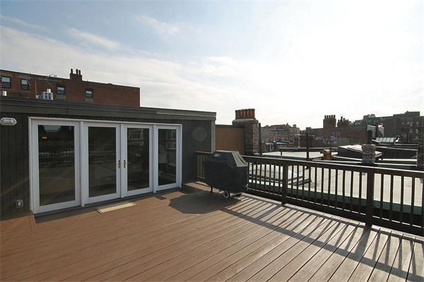 495-497 Beacon Street, Unit 10 Boston, MA 02215 - Photo 6 of 21 a view of a house with a roof deck