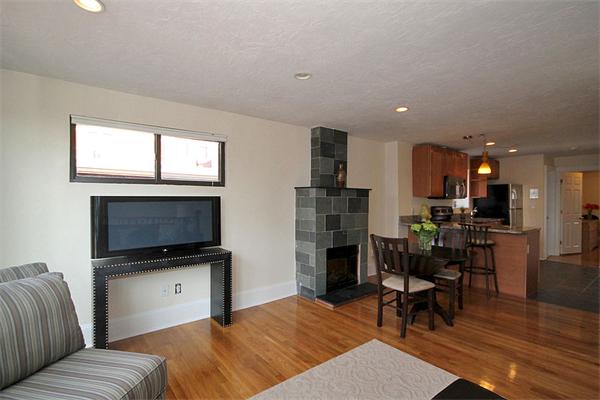 495-497 Beacon Street, Unit 10 Boston, MA 02215 - Photo 10 of 21 a bedroom with furniture and a flat screen tv