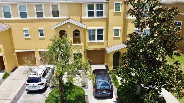 a front view of a house with outdoor seating and plants