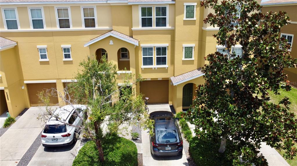 a front view of a house with outdoor seating and plants