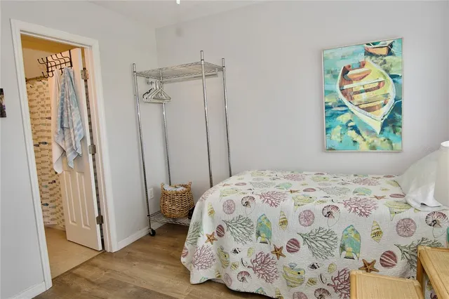 a bedroom with furniture and a window