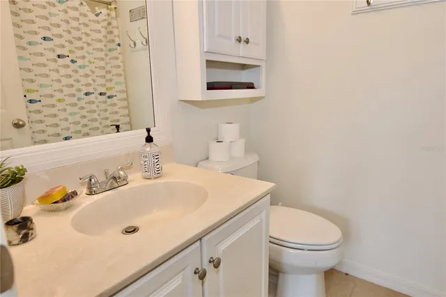 a view of a hallway with a white walls and stairs