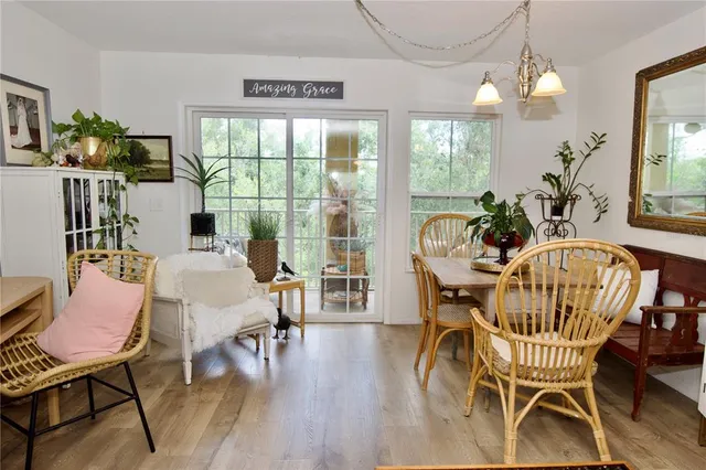 a view of a dining room with furniture window and wooden floor