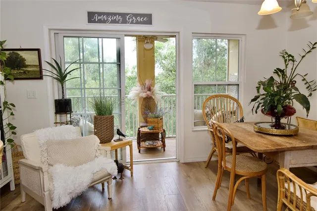 a view of a dining room with furniture window and outside view