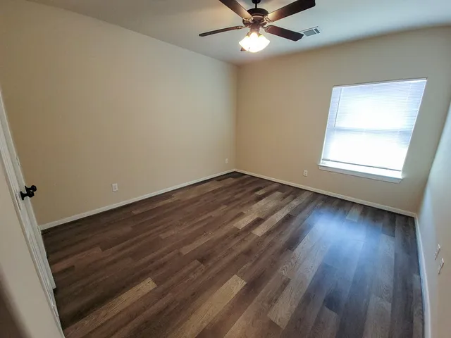 a bathroom with a sink a toilet a mirror and vanity