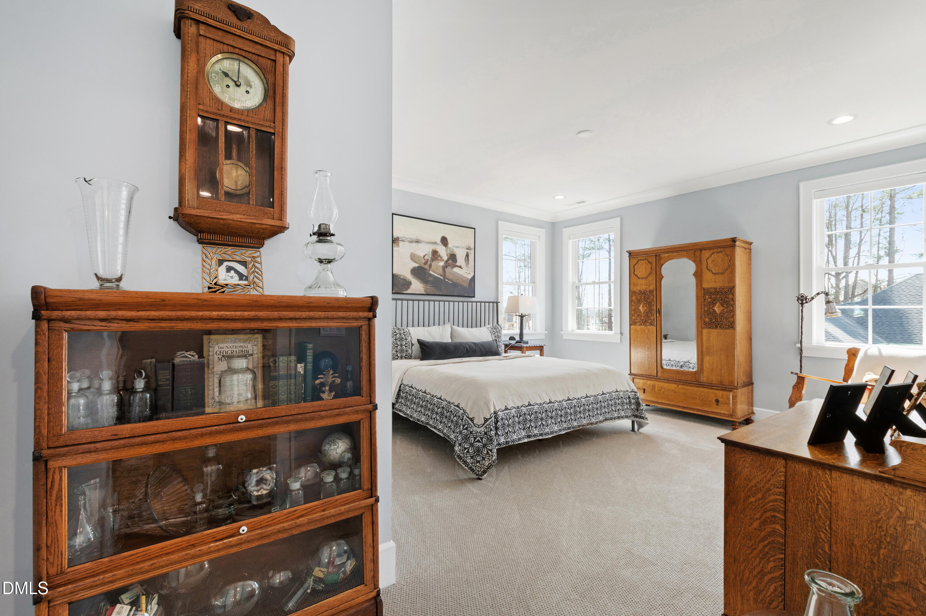 2721 Sanctuary Woods Lane Raleigh, NC 27606 - Photo 24 of 50 a bedroom with a bed and a large window
