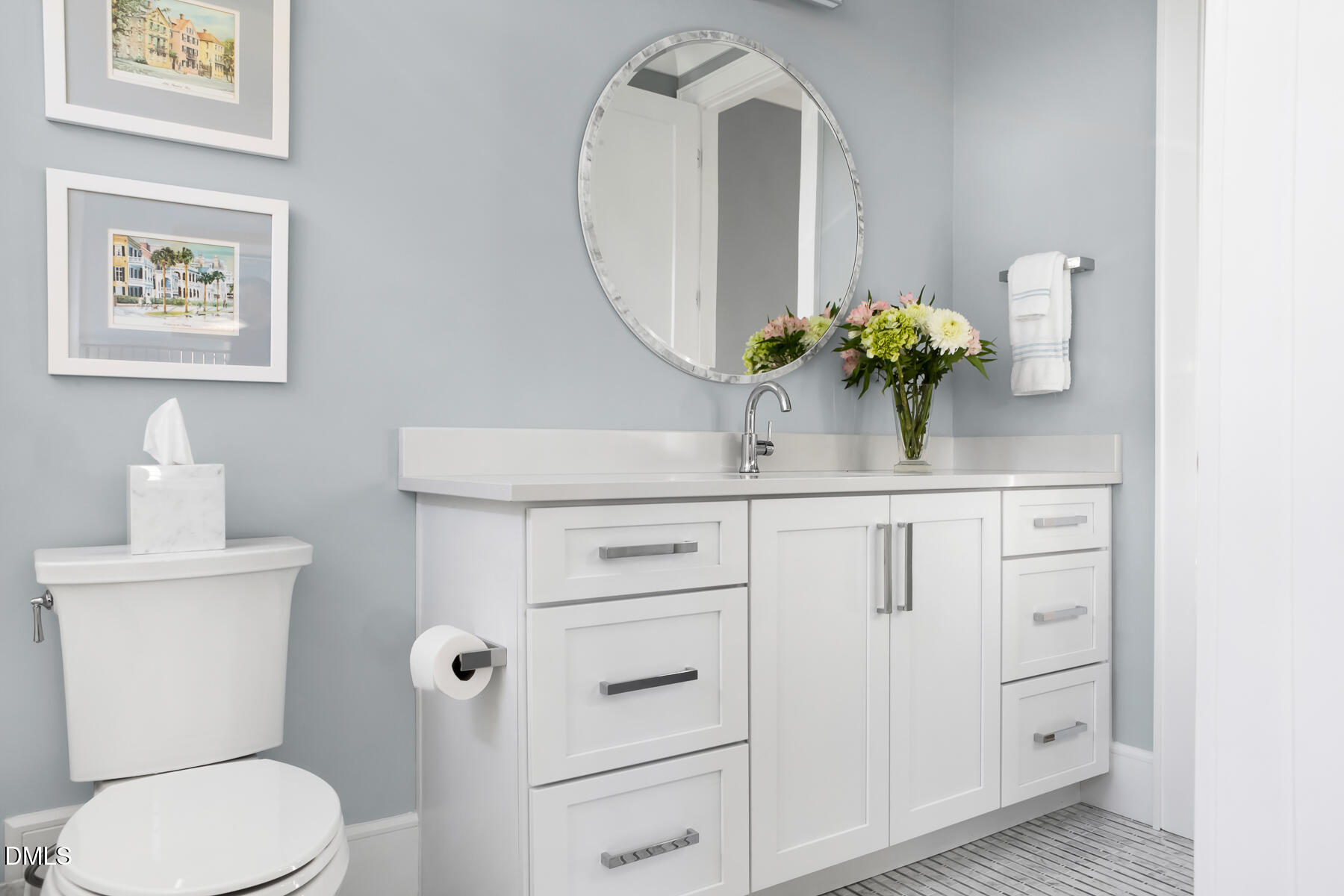 2721 Sanctuary Woods Lane Raleigh, NC 27606 - Photo 25 of 50 a bathroom with a toilet a sink and mirror