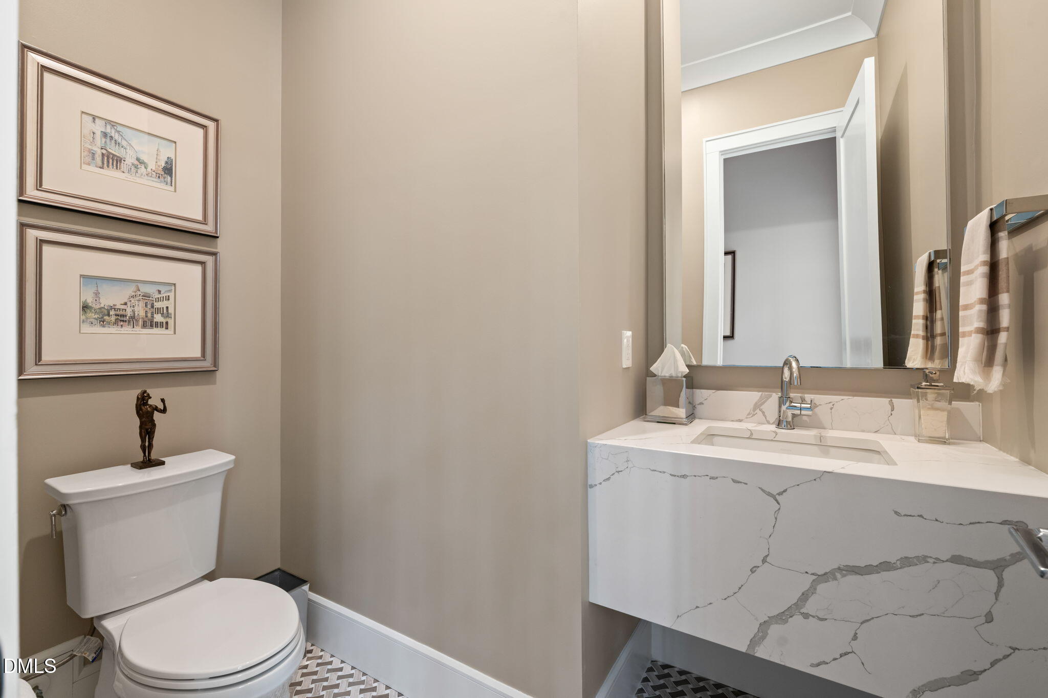 2721 Sanctuary Woods Lane Raleigh, NC 27606 - Photo 30 of 50 a bathroom with a toilet sink and mirror
