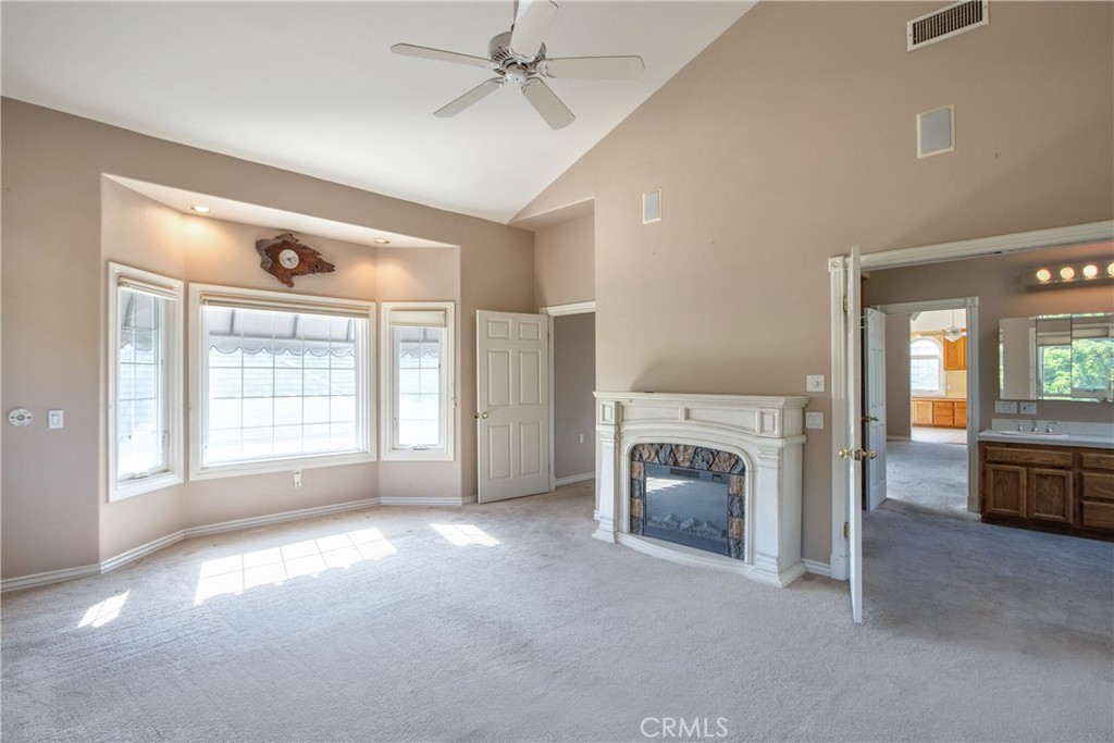 46856 El Prado Road Temecula, CA 92590 - Photo 60 of 75 a view of empty room with fireplace and fan